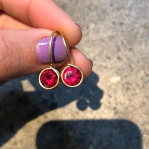 Gold earrings with red stone